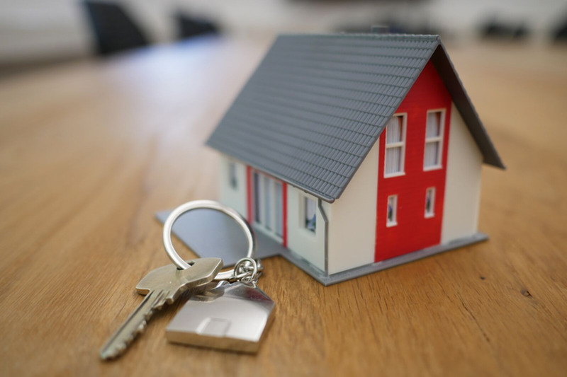 Small house with key on keychain