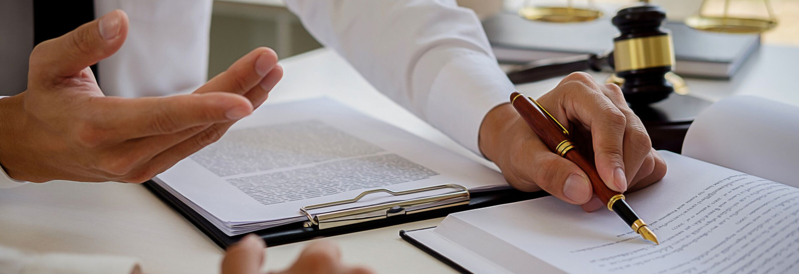 Close up of hand writing in law books