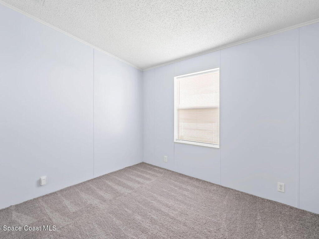 1039 Royal Palm Drive, Barefoot Bay, FL 32976