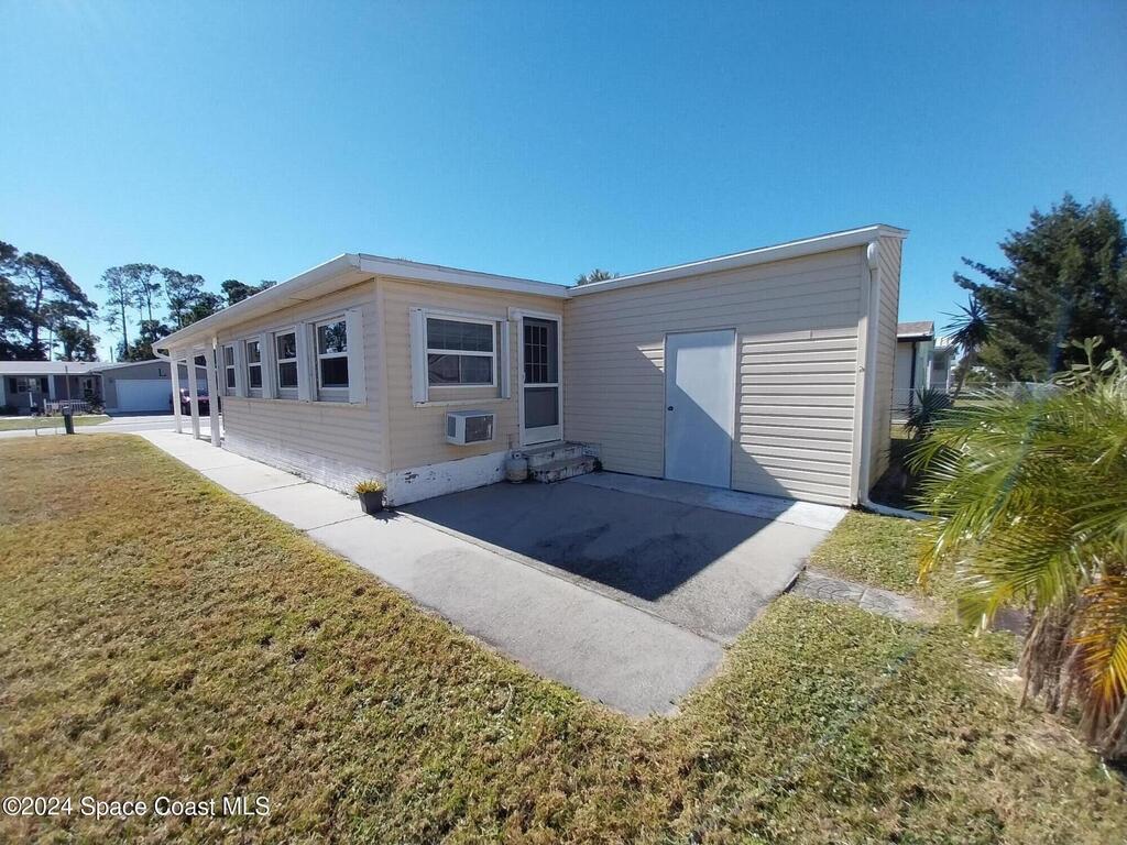 306 Papaya Circle, Barefoot Bay, FL 32976