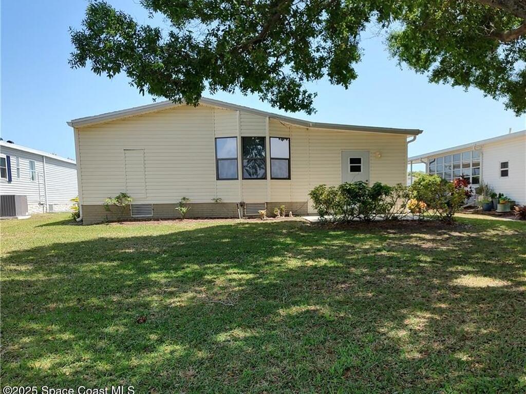 451 Papaya Circle, Barefoot Bay, FL 32976